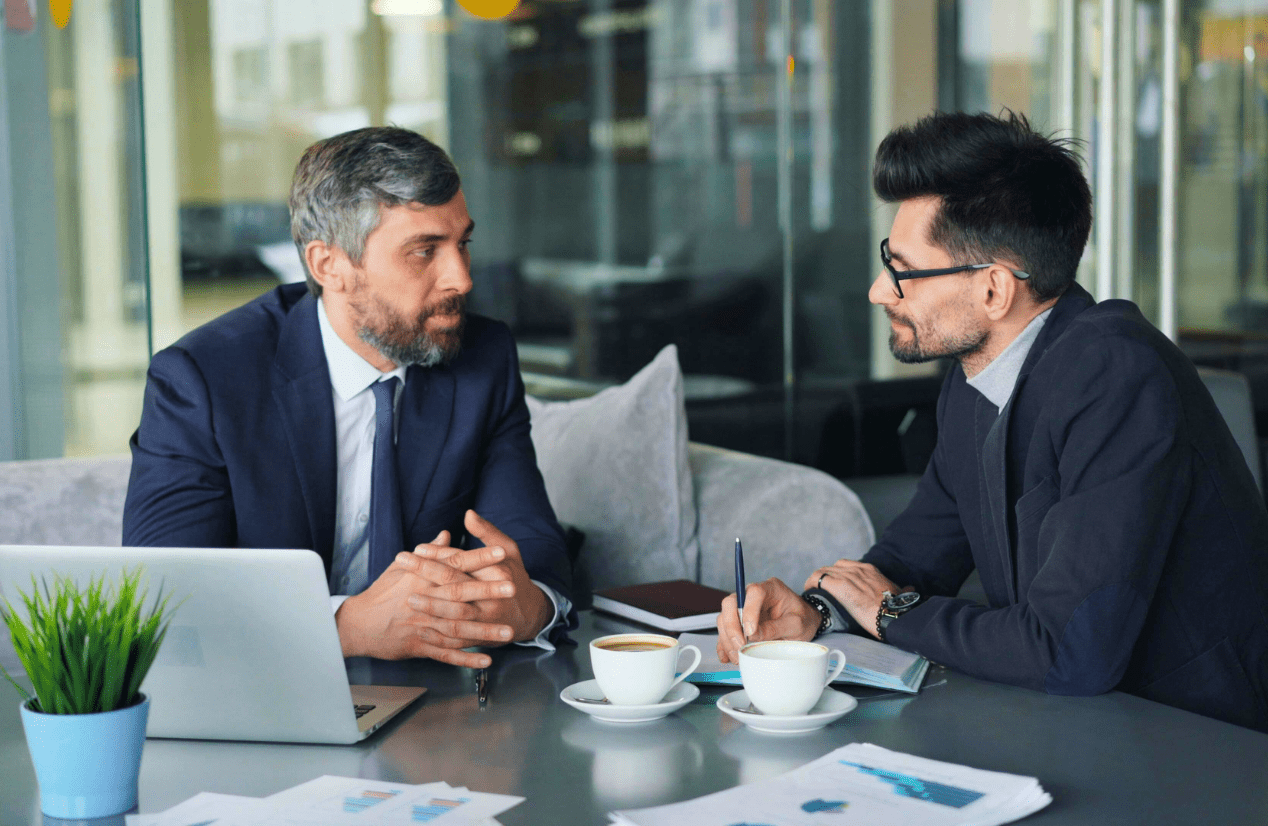 Two business professionals having a discussion. Business Advice. Contract Review Lawyer. Management Consulting Industry