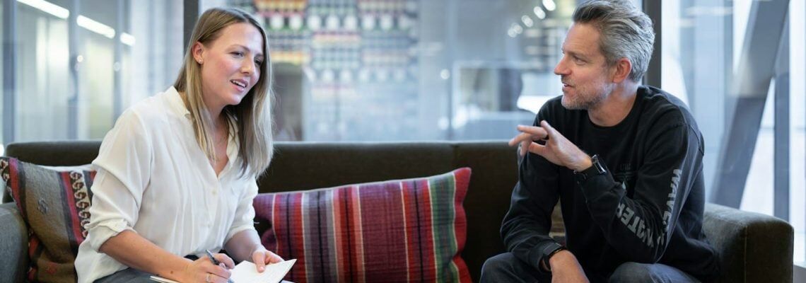A business growth consultant discussing the client's business