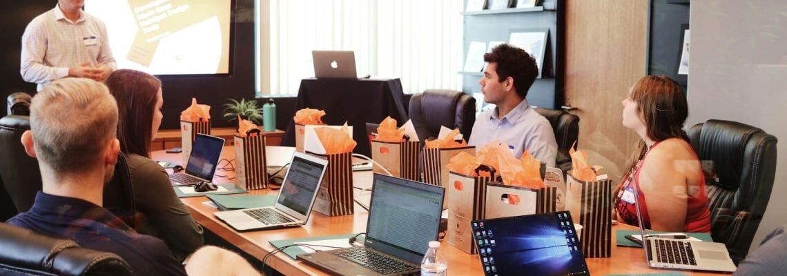 Management Consultant standing in front of clients. Management Consulting Companies Australia