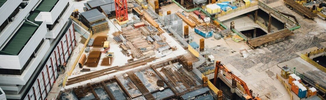 Aerial view of high-rise buildings. Indemnities, Insurances and Limits of Liability in Construction Contracts. Large Business. AS2124-1992. AS2124
